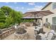 Inviting outdoor space with a fire pit, built-in seating, and outdoor kitchen under a shaded pergola at 4430 Bravery Sw Pl, Concord, NC 28027