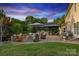Outdoor patio features a built-in fire pit, wood storage, and outdoor seating at 4430 Bravery Sw Pl, Concord, NC 28027