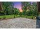 Patio in the back with a beautiful lawn and trees at 5033 Waxhaw Indian Trail Rd, Matthews, NC 28104