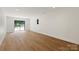 A basement with hardwood floors, a sliding glass door leading to the outside and recessed lighting at 5033 Waxhaw Indian Trail Rd, Matthews, NC 28104