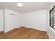 A bedroom featuring hardwood floors, white walls, a closet, a window and recessed lighting at 5033 Waxhaw Indian Trail Rd, Matthews, NC 28104