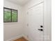 Clean, well-lit entryway with hardwood floors and a view to the outside at 5033 Waxhaw Indian Trail Rd, Matthews, NC 28104