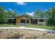 Inviting exterior showcasing a charming two-tone facade and well-maintained lawn at 5033 Waxhaw Indian Trail Rd, Matthews, NC 28104