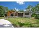 Stunning home featuring modern architectural design and lush green lawn at 5033 Waxhaw Indian Trail Rd, Matthews, NC 28104