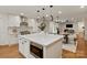Open-concept kitchen flows into the dining area with eat-in island and stainless appliances at 5033 Waxhaw Indian Trail Rd, Matthews, NC 28104