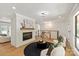 Bright living room with modern fireplace, stylish furnishings, and hardwood flooring at 5033 Waxhaw Indian Trail Rd, Matthews, NC 28104