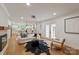 Open living space with modern decor seamlessly connecting to the dining area and kitchen at 5033 Waxhaw Indian Trail Rd, Matthews, NC 28104