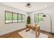 Bright home office with natural light, hardwood floors, and built-in desk at 5033 Waxhaw Indian Trail Rd, Matthews, NC 28104