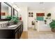 Primary bath featuring double sinks, granite counters, a soaking tub, and a walk-in shower at 530 Shady Oaks Dr, Stanley, NC 28164