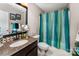 Well-lit bathroom featuring granite counters, decorative mirror, and colorful shower curtain enhancing its appeal at 530 Shady Oaks Dr, Stanley, NC 28164