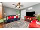 Cozy bedroom featuring a daybed, ceiling fan, television, and a decorative rug adding warmth and style at 530 Shady Oaks Dr, Stanley, NC 28164