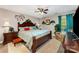 Well-decorated bedroom featuring a queen-sized bed, cozy armchair, and ample natural light at 530 Shady Oaks Dr, Stanley, NC 28164