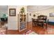 View of dining room with hardwood floors, a decorative chandelier, and a view of the dining room table set for six guests at 530 Shady Oaks Dr, Stanley, NC 28164