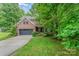 Charming two-story brick home with a well-manicured lawn and attached garage, offering curb appeal and convenience at 530 Shady Oaks Dr, Stanley, NC 28164