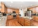 Bright kitchen with stainless steel appliances, granite countertops, and hardwood floors at 530 Shady Oaks Dr, Stanley, NC 28164