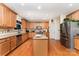 Well-lit kitchen featuring stainless steel appliances and a large island with granite countertops at 530 Shady Oaks Dr, Stanley, NC 28164