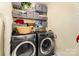 Efficient laundry room equipped with modern washer/dryer units and ample shelving for organized storage solutions at 530 Shady Oaks Dr, Stanley, NC 28164