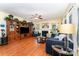 Spacious living room featuring hardwood floors, a cozy fireplace, and a large built-in entertainment center for storage at 530 Shady Oaks Dr, Stanley, NC 28164