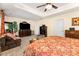 Main bedroom with dark wood furniture, comfortable seating, and ample natural light at 530 Shady Oaks Dr, Stanley, NC 28164