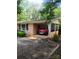 Brick ranch home with a covered carport, mature shrubs, and lush, green lawn at 536 Catalina Dr, Albemarle, NC 28001