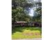 Charming brick ranch home featuring a covered carport, manicured lawn, and mature trees at 536 Catalina Dr, Albemarle, NC 28001