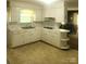 Charming kitchen featuring ample counter space, white cabinets and a view to the adjacent room at 536 Catalina Dr, Albemarle, NC 28001