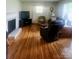 Bright living room boasting hardwood floors, a fireplace, and comfortable seating at 536 Catalina Dr, Albemarle, NC 28001