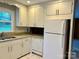 Functional kitchen with white cabinets, granite countertops, and modern appliances at 5734 Brookhaven Rd, Charlotte, NC 28210