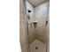 Tiled shower stall with a built-in shelf and a rainfall shower head provides a spa-like experience at 5734 Brookhaven Rd, Charlotte, NC 28210