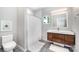Functional bathroom with a modern vanity, tiled shower, and clean, neutral color scheme at 5925 Creola Rd, Charlotte, NC 28270