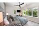 Modern bedroom with large windows, comfortable queen bed, and a dedicated workspace with desk at 5925 Creola Rd, Charlotte, NC 28270