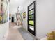 Bright foyer with wood floors, modern staircase, and sleek front door with sidelights at 5925 Creola Rd, Charlotte, NC 28270