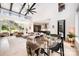 Open-concept living room with dining area, modern staircase, and comfortable furnishings at 5925 Creola Rd, Charlotte, NC 28270