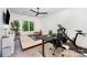 Bright home office featuring a standing desk, exercise bike, and ample natural light at 5925 Creola Rd, Charlotte, NC 28270