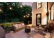 Relaxing outdoor patio with stylish seating, a fire pit, and atmospheric string lights at 5925 Creola Rd, Charlotte, NC 28270