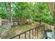 Scenic view from the balcony overlooking a well-maintained lawn and mature trees at 5927 Quail Hollow Rd # H, Charlotte, NC 28210