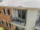 Cozy balcony with seating adjacent to a sliding glass door at 5927 Quail Hollow Rd # H, Charlotte, NC 28210