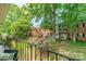 Scenic view from the balcony overlooking mature trees and neighboring buildings at 5927 Quail Hollow Rd # H, Charlotte, NC 28210
