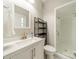 Updated bathroom featuring a glass-enclosed shower, modern vanity, and neutral color palette at 5927 Quail Hollow Rd # H, Charlotte, NC 28210