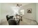Bright bedroom featuring natural light, a ceiling fan, two comfy armchairs, and neutral carpeting at 5927 Quail Hollow Rd # H, Charlotte, NC 28210