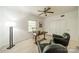 Large bedroom featuring neutral carpet, closet, ceiling fan, and two chairs at 5927 Quail Hollow Rd # H, Charlotte, NC 28210