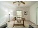Spacious bedroom featuring two chairs, neutral carpet, ceiling fan, and lots of natural light at 5927 Quail Hollow Rd # H, Charlotte, NC 28210