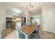Well-lit dining area with access to the kitchen, features modern lighting and room for entertaining at 5927 Quail Hollow Rd # H, Charlotte, NC 28210