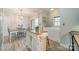 Bright kitchen features dining area, butcher block counters, stainless steel appliances, and center island at 5927 Quail Hollow Rd # H, Charlotte, NC 28210