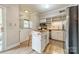 Bright kitchen features stainless steel appliances, butcher block counters, and center island with breakfast bar seating at 5927 Quail Hollow Rd # H, Charlotte, NC 28210