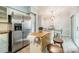 Bright kitchen features dining area, butcher block counters, stainless steel appliances, and center island at 5927 Quail Hollow Rd # H, Charlotte, NC 28210