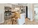 Efficient kitchen boasts stainless steel appliances, ample storage, and a convenient rolling island at 5927 Quail Hollow Rd # H, Charlotte, NC 28210