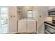 Bright laundry room features washer, dryer, and access to a balcony at 5927 Quail Hollow Rd # H, Charlotte, NC 28210