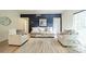 A cozy living room featuring a navy accent wall with white sofas and a woven rug at 5927 Quail Hollow Rd # H, Charlotte, NC 28210