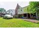 View of the home's backyard, garage, and stair access to an upper floor at 611 E Marion St, Shelby, NC 28150